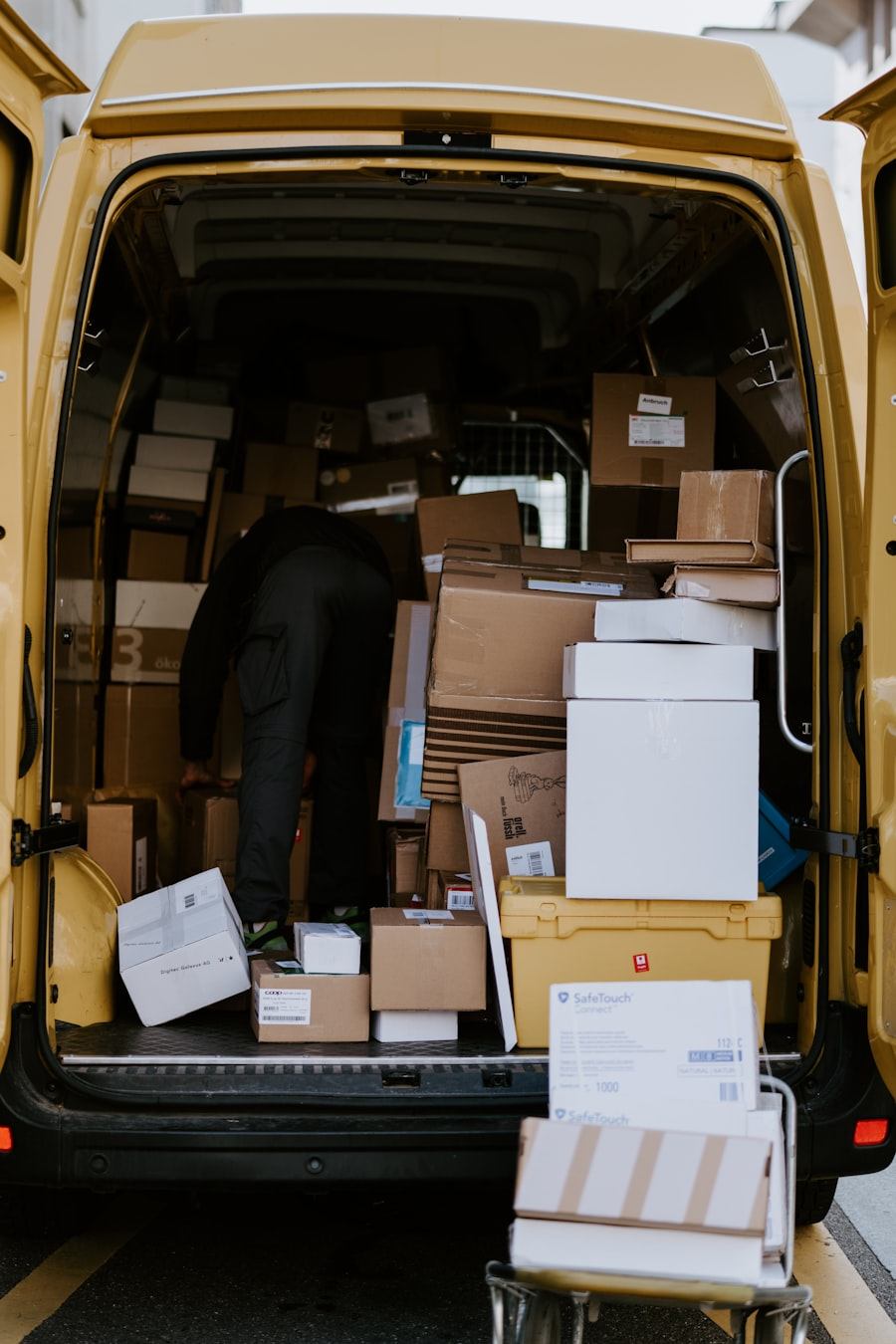 Crew loading packed boxes into a moving van