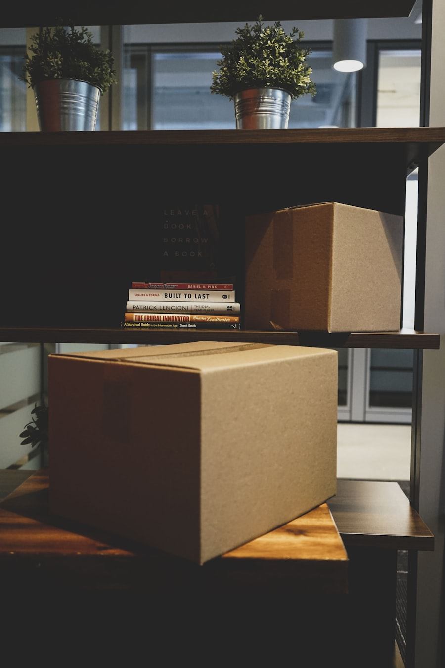 Packed cardboard box on an office shelf ready for relocation