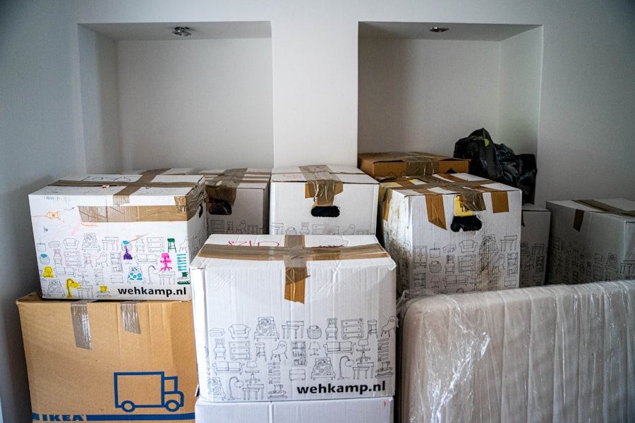 Household items packed in cartons with a wrapped mattress